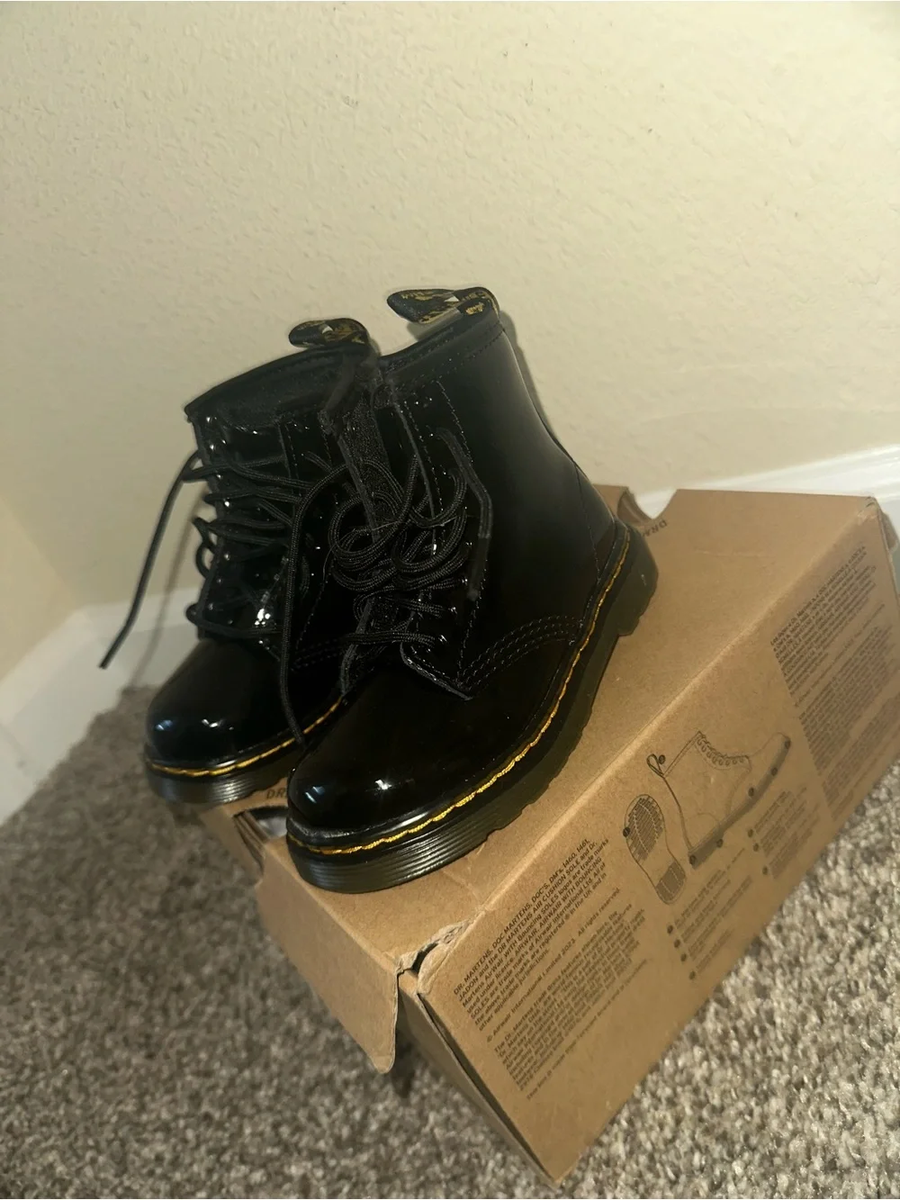Dr. Martens Kids Black Patent Lace-Up Boots with Yellow Stitching